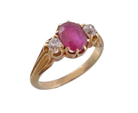 A Victorian diamond and ruby three stone ring, circa 1890, the oval cut ruby estimated to weigh 1.14 carats flanked by two ol