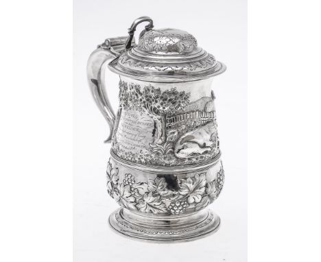 An early George III silver later chased tankard by Francis Crump, London 1761, the double domed cover with an open chair-back