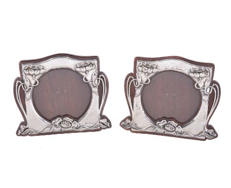 A matched pair of Art Nouveau silver photograph frames, by Moore &amp; Clark, Birmingham 1903, and by T. Wooley, Birmingham 1