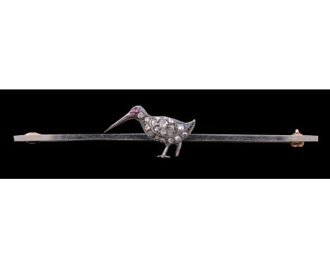 A diamond and ruby snipe bar brooch, circa 1920, the snipe set with rose cut diamonds with a circular cabochon ruby eye, stam