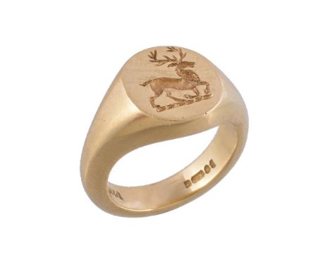 An 18 carat gold signet ring, the panel carved with a stag, stamped 750 with full London hallmarks for 1967, finger size G 1/