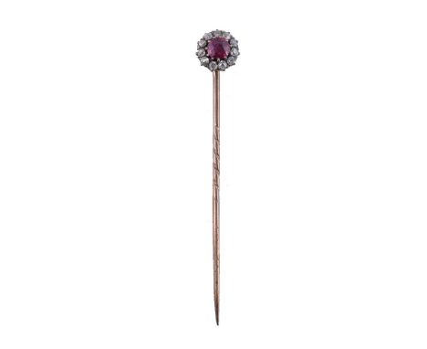 A late Victorian ruby and diamond cluster stickpin, circa 1890, the circular cut ruby within a surround of old cut diamonds, 