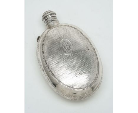 A Victorian silver rounded oval spirit flask by Alfred Taylor, Birmingham 1866, with a screw cover, engine turned with a cup 