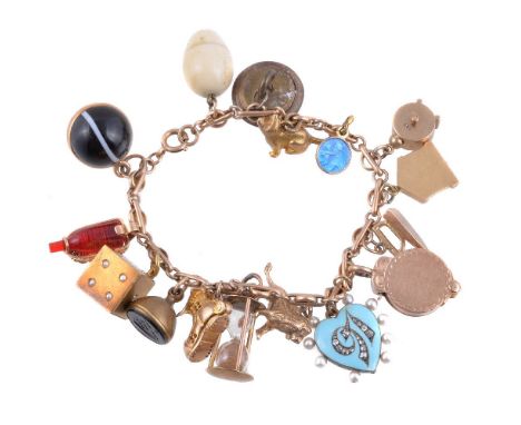 ϒA gold coloured charm bracelet and charms, the belcher link bracelet with various charms, including: a cat charm with diamon