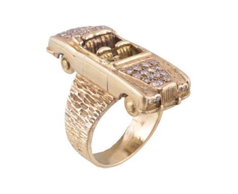 An 18 carat gold and diamond car ring, the cabriolet set with brilliant cut diamonds approximately 0.35 carats total, stamped