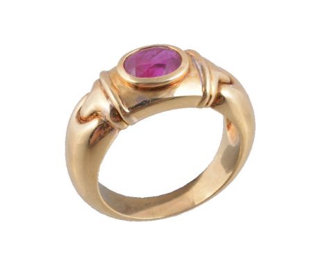 A ruby ring, the oval cut ruby, estimated to weigh 1.45 carats, collet set on a polished band, stamped 750, finger size M, 9g