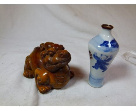 Chinese carved horn Kyra and a snuff bottle with four character seal to base