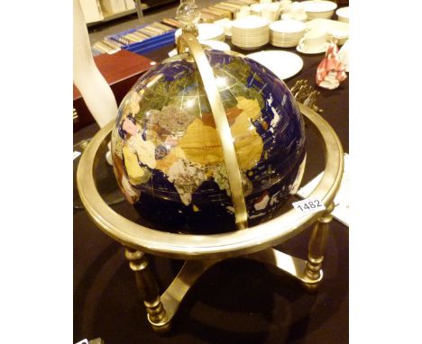 Large globe set with semi precious stones on a brass support, D: 32 cm