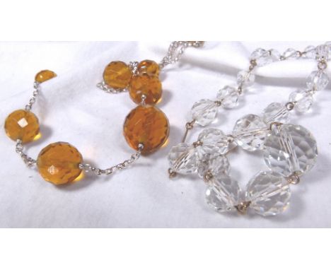 Silver and golden quartz necklace plus a vintage quartz necklace in a wooden box