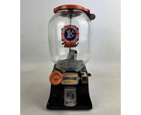 Northwestern model 31 1-cent coin-operated peanut machine ca. 1931. Cast iron base with brass coin slot and glass dome. Very 