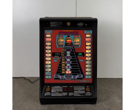 1985 German NSM-Lowen Triomint Pyramide slot machine. Very good visual condition, shows a little wear. The machine powers on,