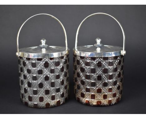 A Pair of Overlaid Ruby Glass Style Biscuit Barrels with Silver Plated Lids and Loop Handles