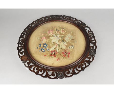 A 19th Century Circular Pierced Mahogany Framed Containing Floral Tapestry, 41cms Diameter Overall, Condition Issues