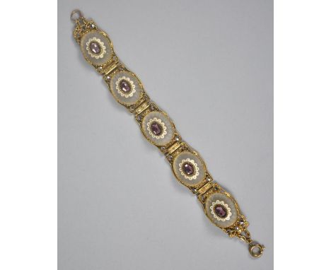 A Vintage Czechoslovakian Camphor Glass, Enamel and Paste Amethyst Coloured Stone Panel Bracelet Comprising Five Gold Tone Pa