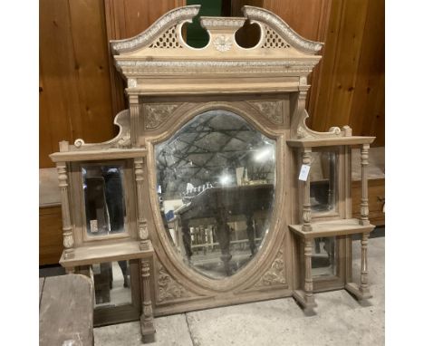 Late 19th century pine and gesso mirror back or wall mirror, pierced broken swan neck pediment decorated with foliate and cen