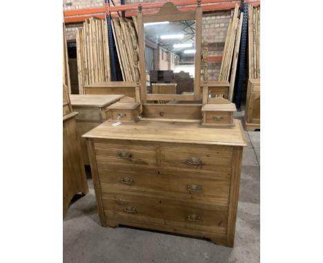 Edwardian pine dressing chest, raised back with rectangular swing mirror over trinket drawers, fitted with two short over two