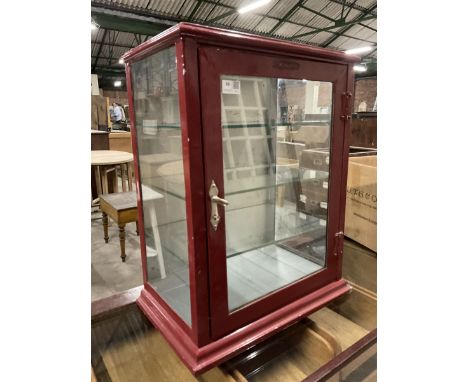 Early 20th century glazed and red enamel wall mounting medicine or pharmaceutical shop display cabinet, single door enclosing