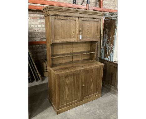 Late Victorian pitch pine dresser, moulded cornice over raised panelled cupboard and shelf, rectangular top over double panel