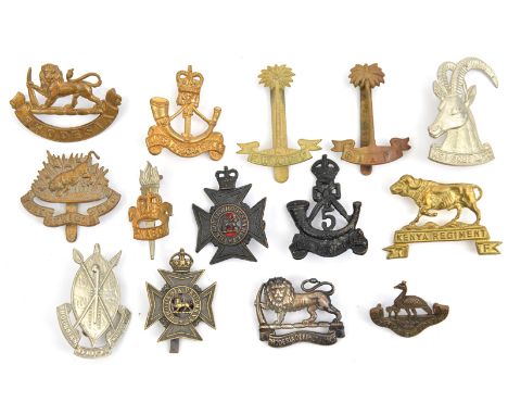 12 Commonwealth African cap badges: RWAFF brass and gilt, W Africa Regt, Kenya Regt, ERII 1st KAR, KC blackened 5th KAR, ERII