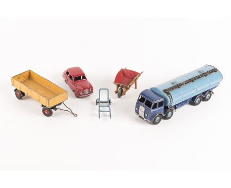 5 Dinky Toys. An Austin Somerset in red, a Foden Tanker with dark blue cab and light blue tank, a large trailer, a sack barro