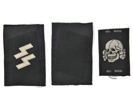 A pair of Third Reich SS woven collar patches, consisting of a blank patch and a basic SS runes patch, uncut on sections of b