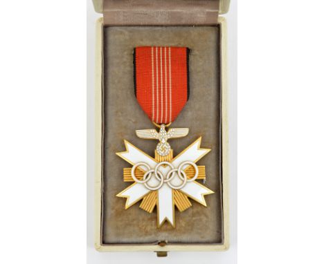 A Third Reich German Olympic Games award, 2nd class, in gilt and enamel, with ribbon and pin, in its original case. The award