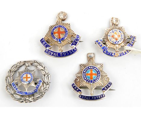 3 R Sussex sweetheart brooches, blue and red enamelled design as for cap badge and another similar in wreath, all marked “Ste