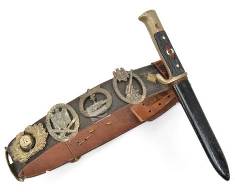 A Third Reich Luftwaffe belt, with blackened steel buckle, the flap dated 1940, mounted with a Hitler Youth knife by Herder, 