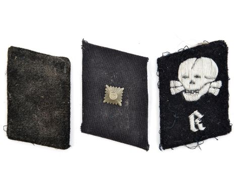 A Third Reich SS Totenkopf officer’s silver bullion embroidered skull over “K” collar patch, and a pair of rank collar patche