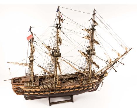 A model of a French man of war from 1785, Le Superbe. A  detailed wooden kit built model with 3 masts, full rigging, furled s