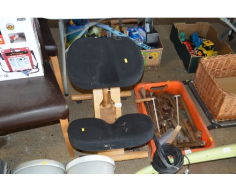 A wooden typing stool
