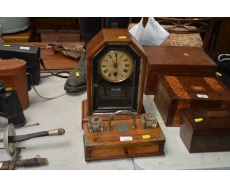 A metal mounted oak desk stand fitted single drawer; together with a single hole mantle clock