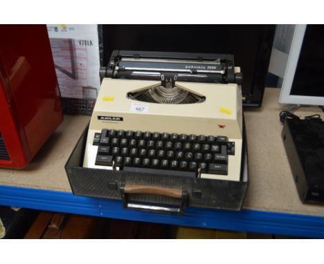 An Adler portable typewriter in fitted case