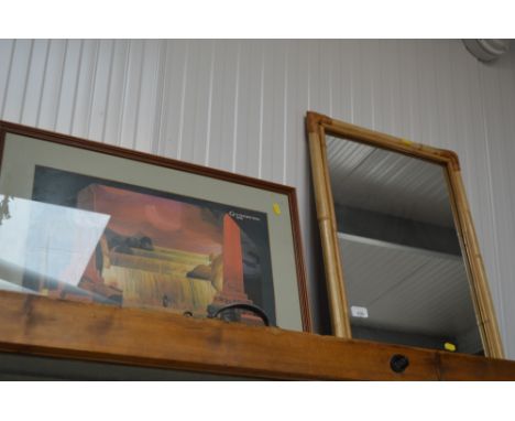 A cane framed mirror; together with a framed print 
