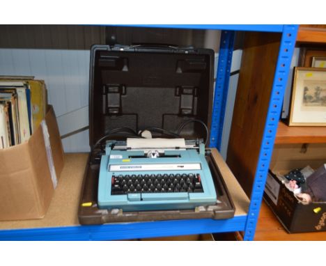 A Super Sterling portable typewriter in fitted case