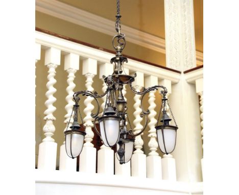 AN ARTS AND CRAFTS BRASS CHANDELIER LATE 19TH CENTURY  With C-scroll supports throughout, the four arms terminating with unus