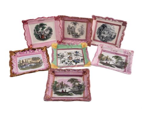 A GROUP OF SEVEN SUNDERLAND LUSTRE WALL PLAQUES  MID 19TH CENTURY Typically modelled as picture frames and variously printed 