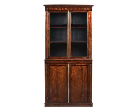 Y&nbspA REGENCY SIMULATED ROSEWOOD CABINET BOOKCASE CIRCA 1820 Of compact proportions, each section opening to adjustable she