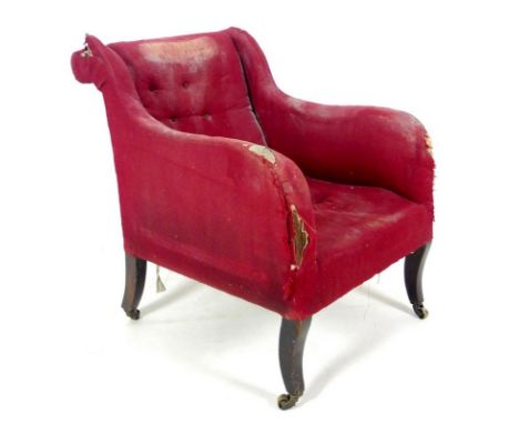 A 19th century mahogany framed easy armchair, in the manner of Howard & Sons, with scroll back and shaped arms, upholstered i