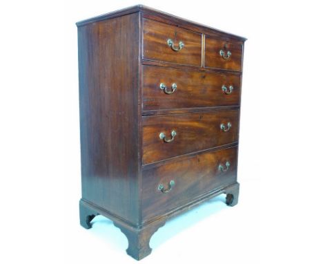 A George III mahogany chest of two over three graduating drawers, with brass swan neck handles and cock beading, wide crossba