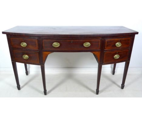 A George III, Sheraton Period, bowfronted server sideboard, mahogany, inlaid and crossbanded, with four drawers including dec