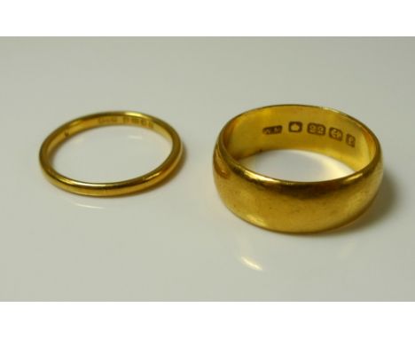 A 22ct gold wedding band, size M, 5.9g, together with a further 22ct gold wedding band, size K, 1.6g. (2)