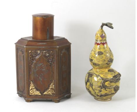  An early 20th century Chinese hexagonal pewter tea caddy bronzed and gilded, decorated with calligraphy and engraved flowers