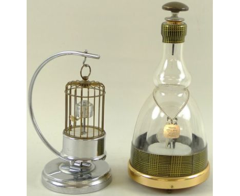 A vintage Kaiser Bird Cage Alarm clock, complete with chromed stand and original instructions and guarantee, together with a 