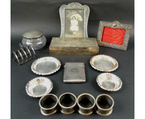 A collection of Victorian and Edwardian silver including a cigarette box, engine turned, cedar lined, London 1937, Goldsmiths