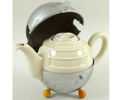 A 1930s WMF Bauscher bachelor's tea pot, Art Deco deign with the cream glazed ceramic body encircled by white metal cover wit