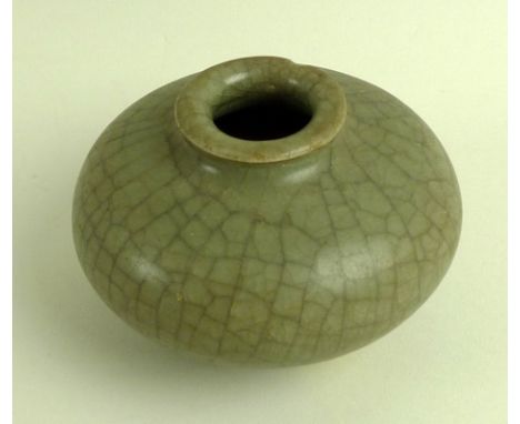 A rare Chinese stoneware jar, Sung / Song Dynasty (960-1279), of flattened ovoid form with flared rim, 'Ko' type, pale grey l