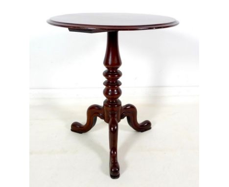 A Victorian mahogany occasional table, circular surface with moulded edge, turned column raised on three carved cabriole legs