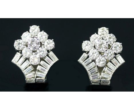 A pair of Art Deco diamond and platinum ear clips, mounted by Cartier, circa 1930, in the form of flowers, each with central 