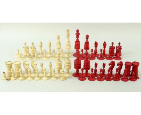 A quantity of plain and red stained ivory chess pieces, early 20th century, from two different sets, in English Calvert style